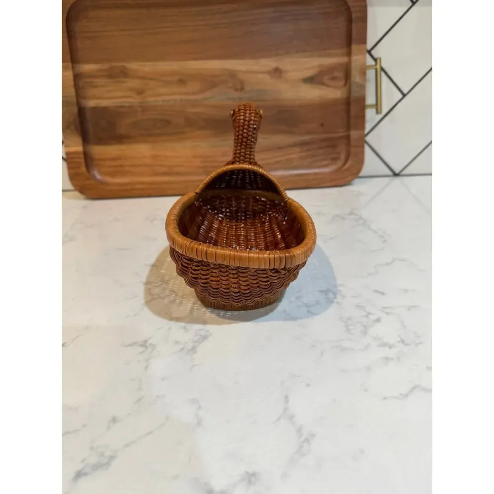 handwoven rattan duck basket elongated oval bowl design integrated duck head
